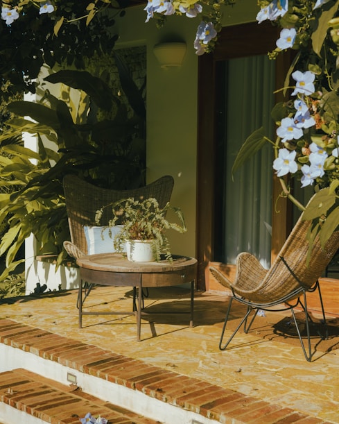 Two chairs and a table on a patio