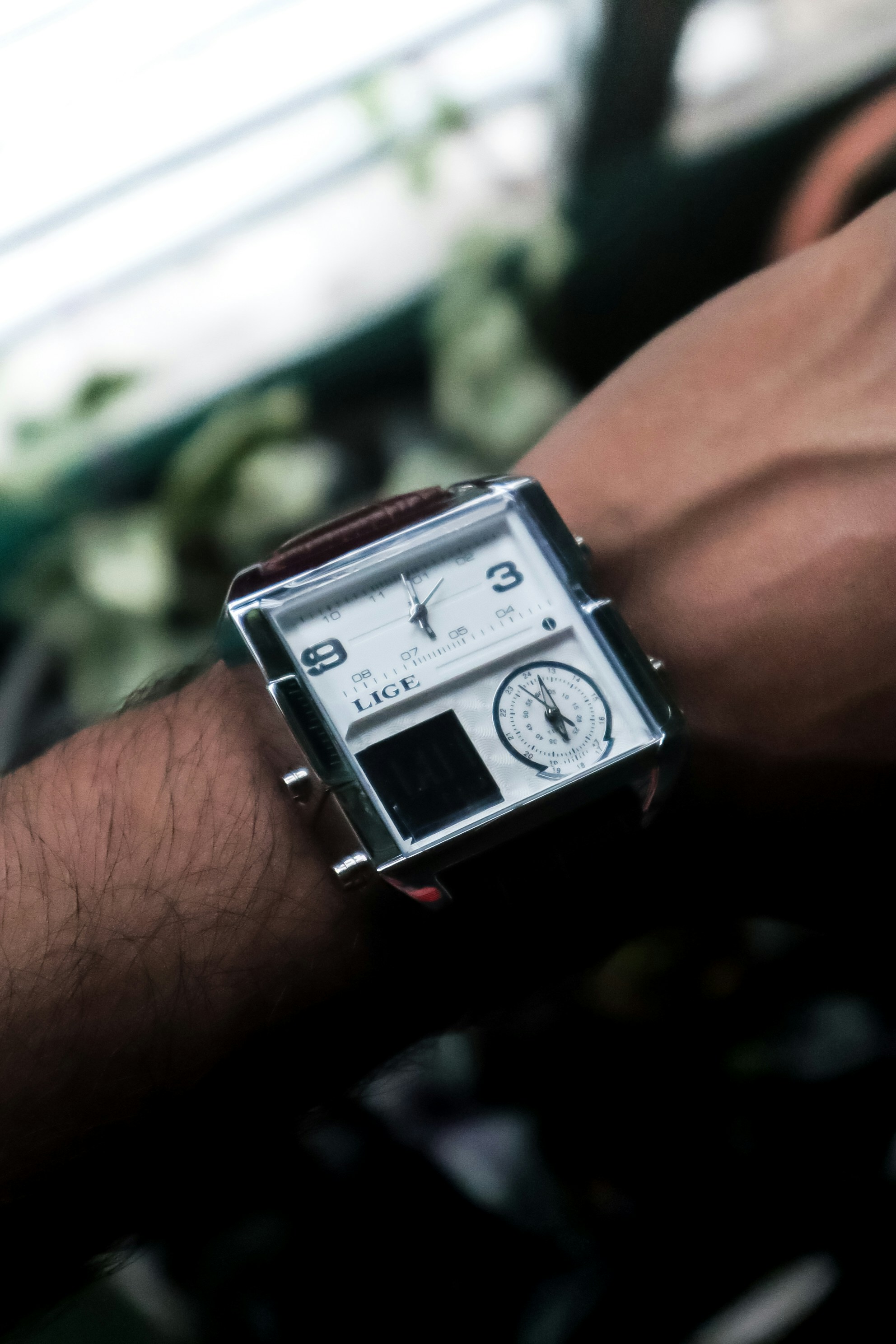 A close up of a person wearing a watch
