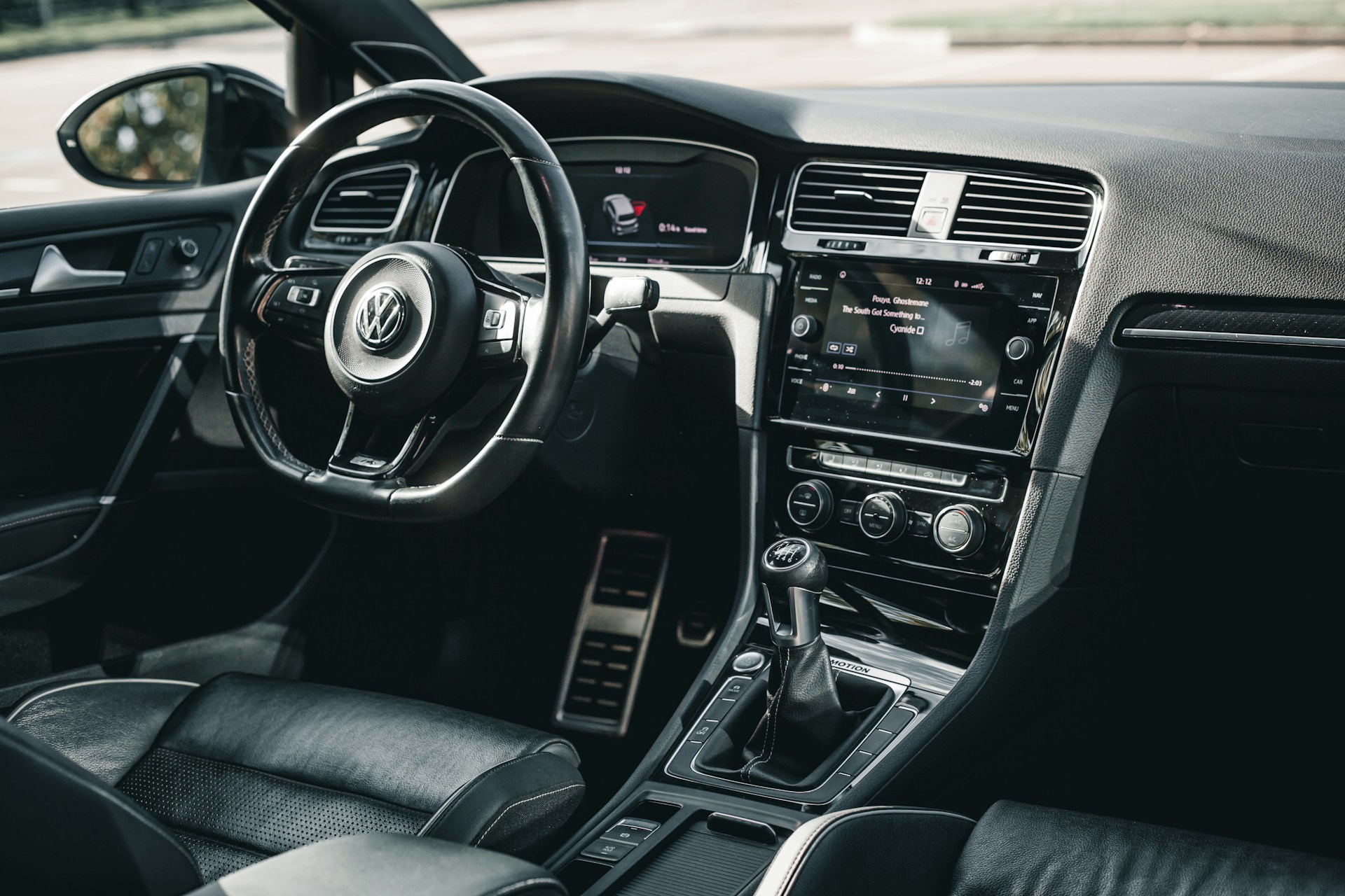 The interior of a car with black leather seats