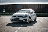 A white car parked in a parking lot