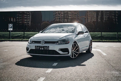 A white car parked in a parking lot