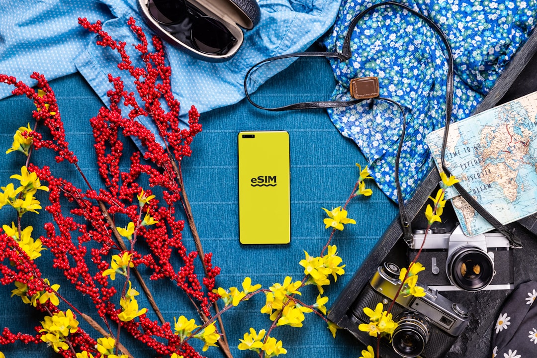 A bunch of items that are on a table, eSIM technology for traveling with Android phone