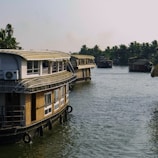 A group of houses floating on top of a river