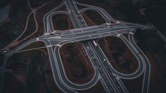 An aerial view of a highway intersection at night