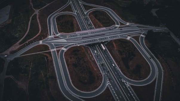 An aerial view of a highway intersection at night