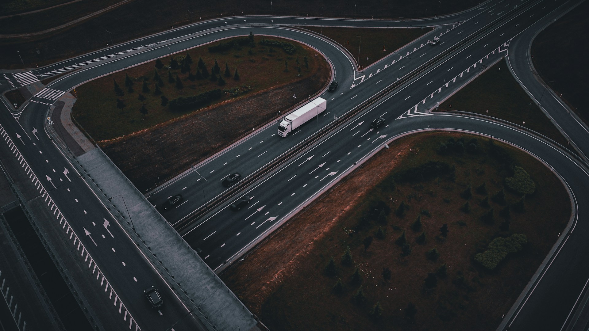 An aerial view of a highway intersection at night