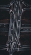 An aerial view of a highway intersection at night