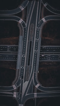 An aerial view of a highway intersection at night