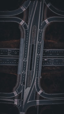 An aerial view of a highway intersection at night