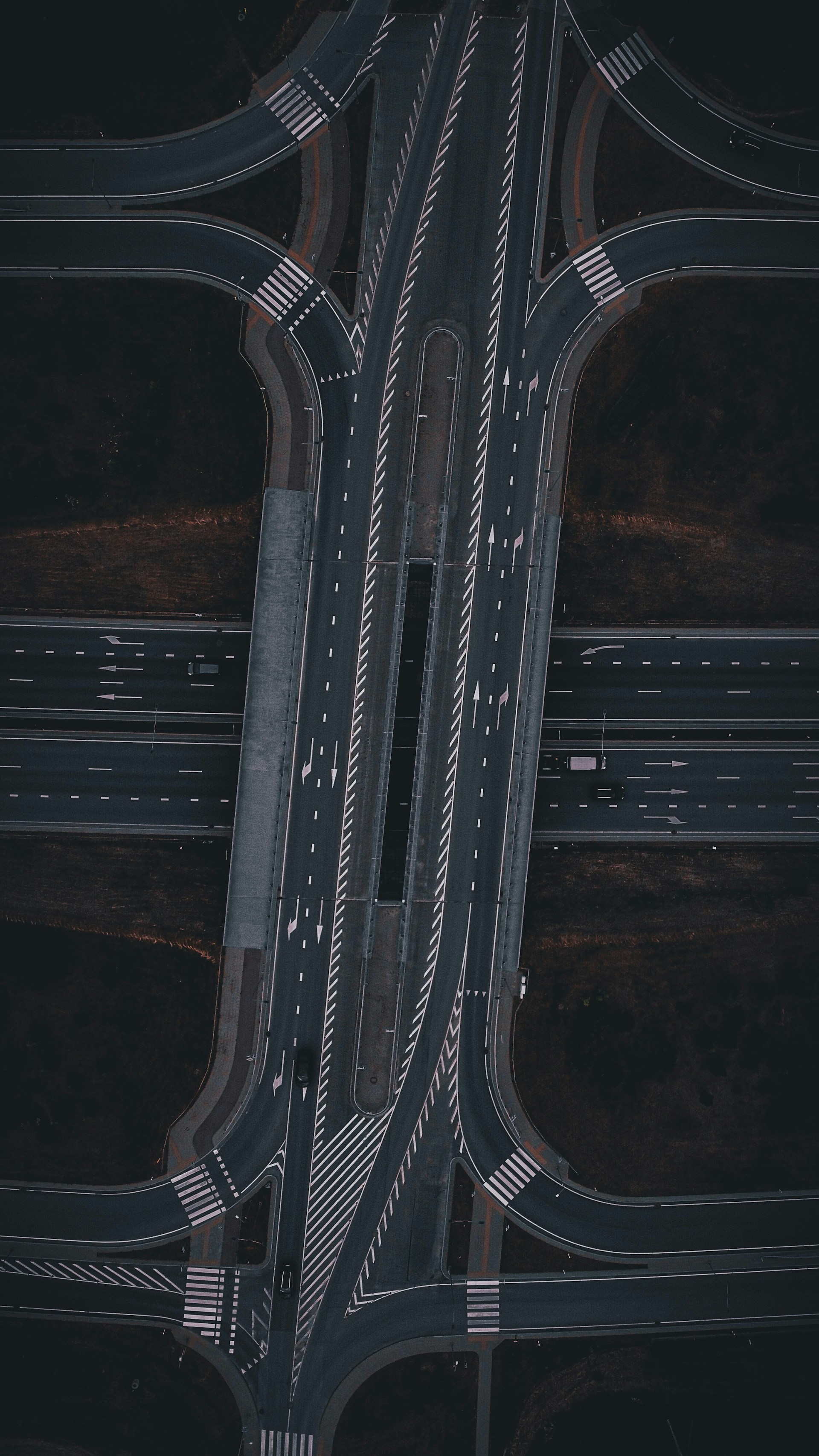 An aerial view of a highway intersection at night