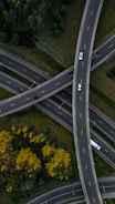 An aerial view of a highway intersection with multiple lanes