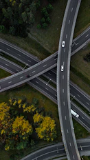 An aerial view of a highway intersection with multiple lanes