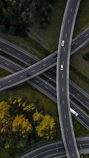 An aerial view of a highway intersection with multiple lanes