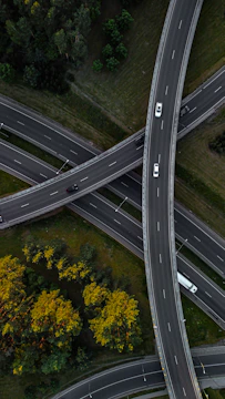 An aerial view of a highway intersection with multiple lanes