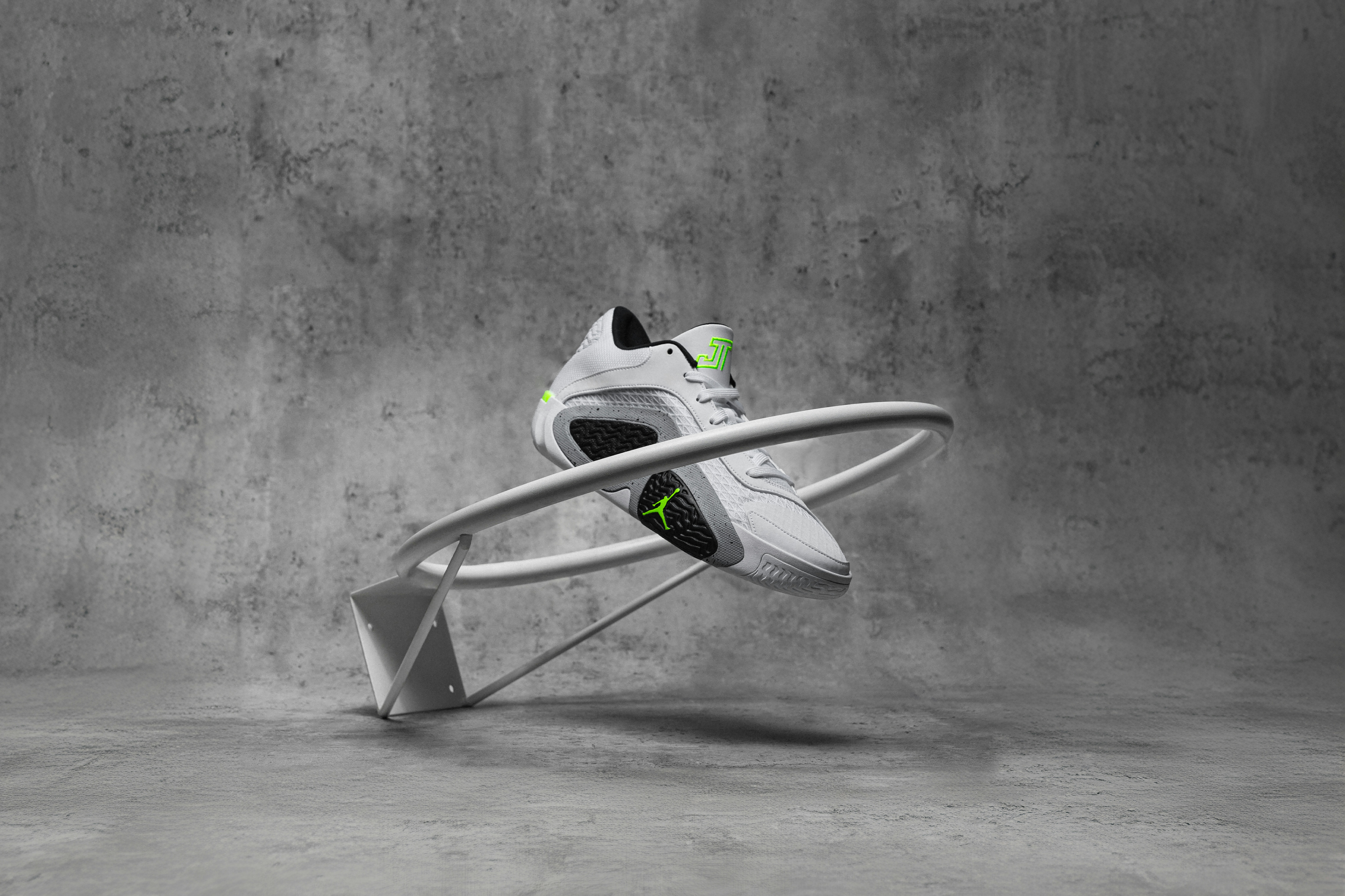 A pair of white shoes sitting on top of a white chair