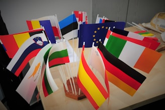 A bunch of flags that are on a table