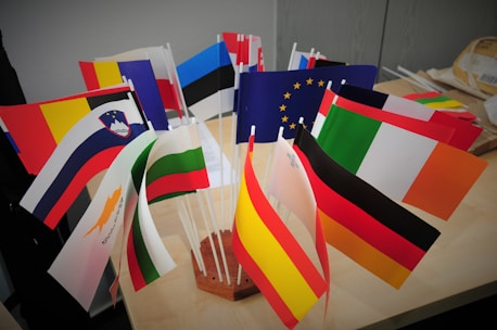 A bunch of flags that are on a table