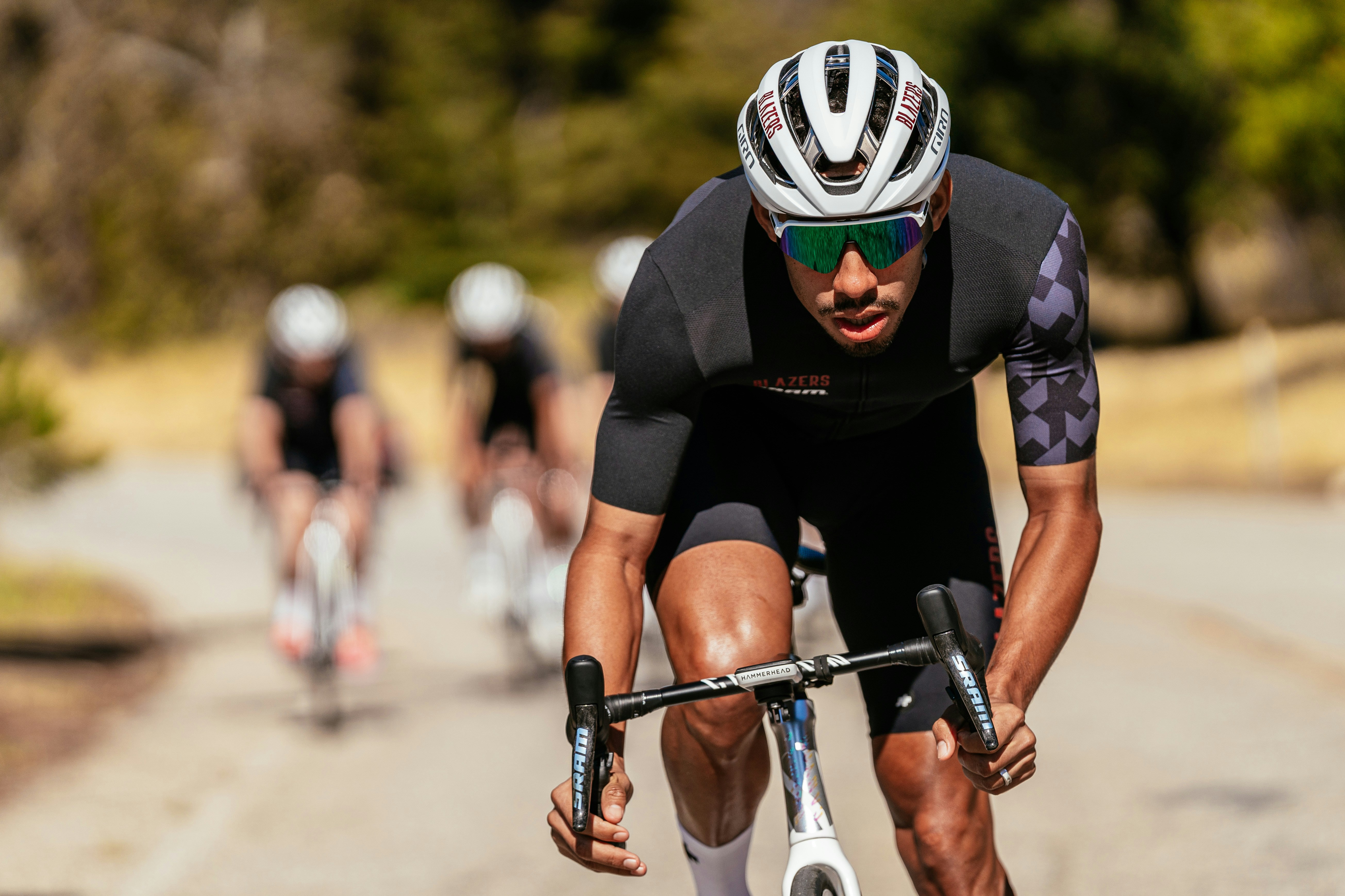 A man riding a bike down a street