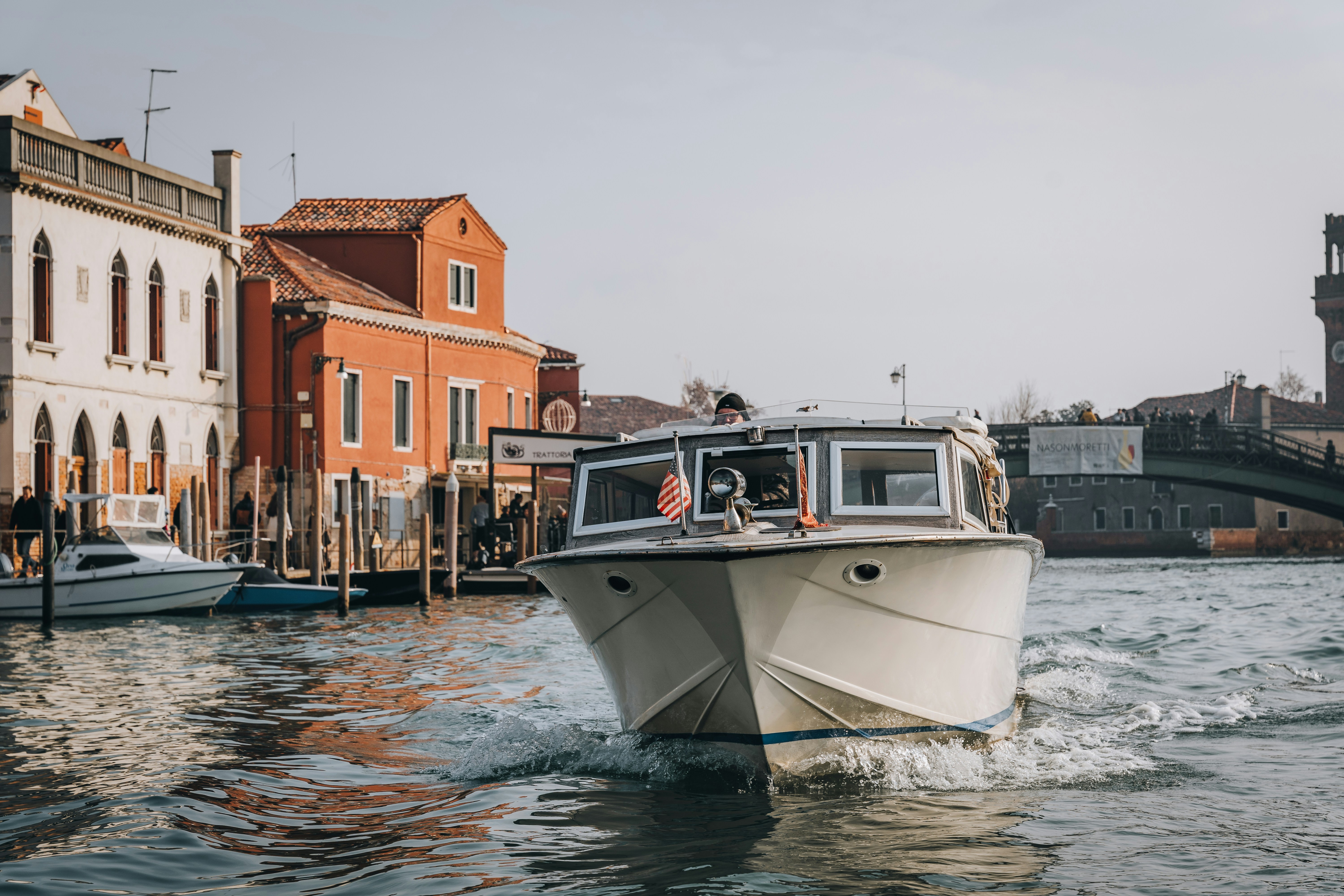Cruising in a motor boat through Murano