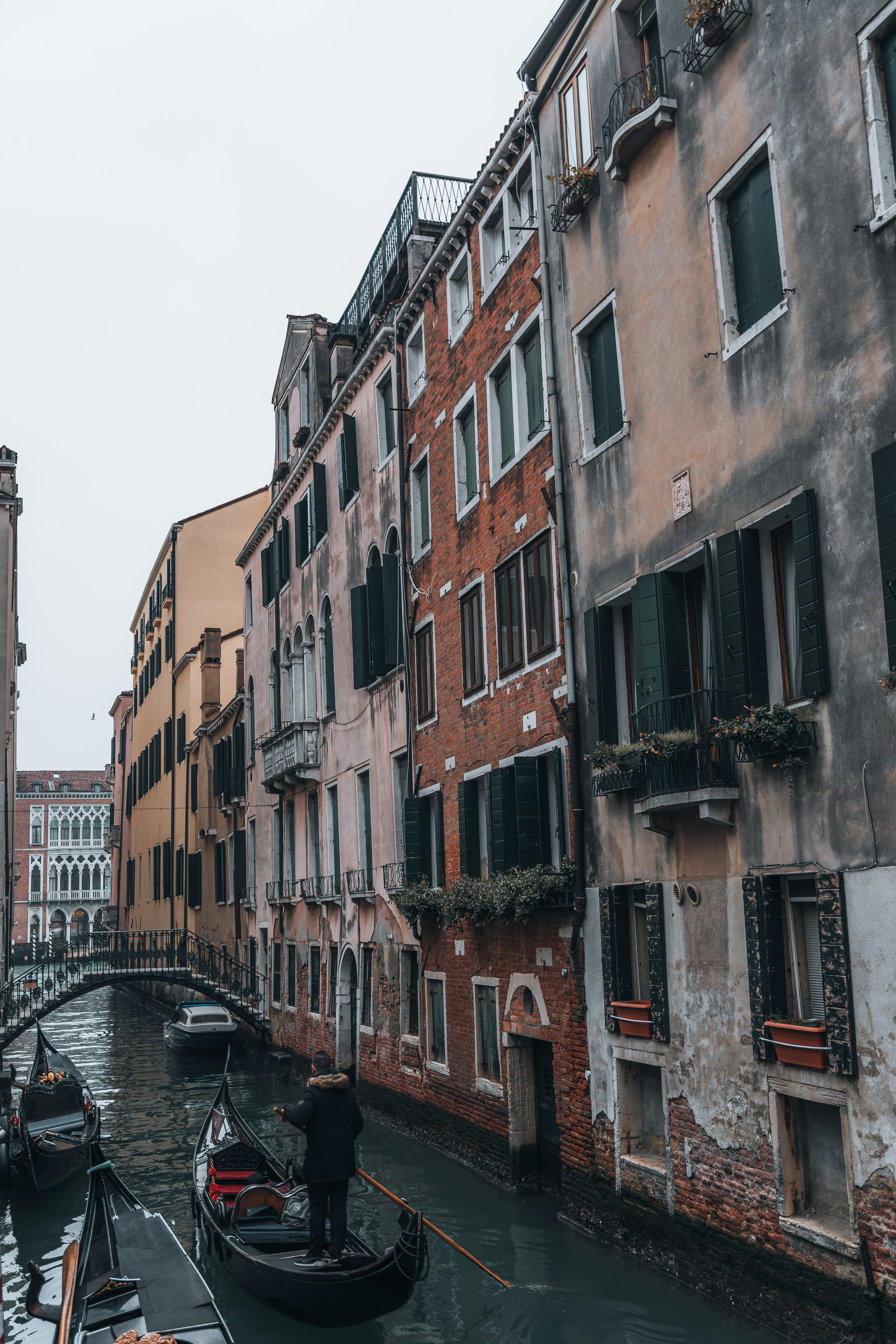 Small canal with gondolas in Venice
