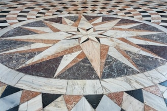 A marble floor with a star design on it
