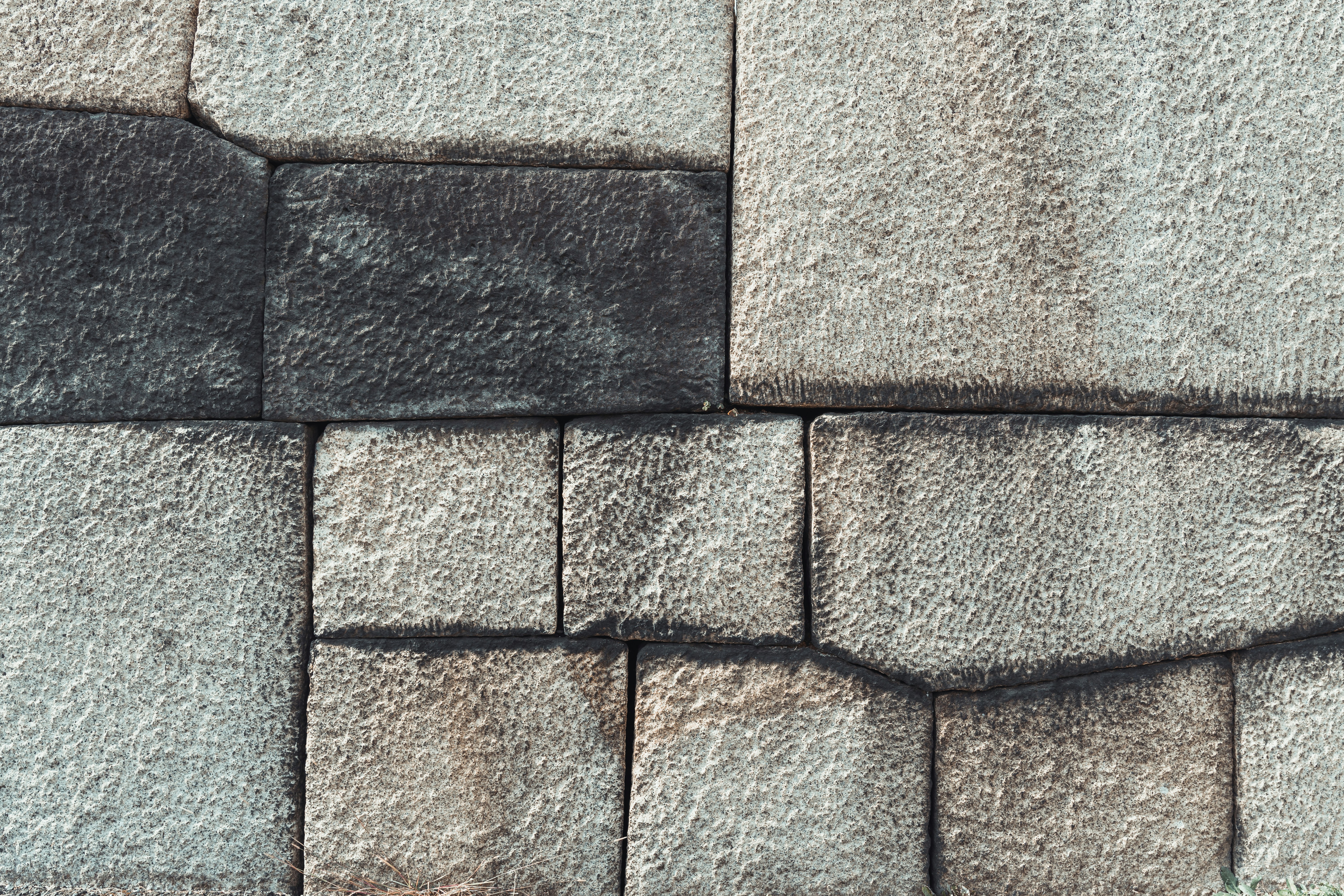 Stone wall of the Tenshudai tower in the imperial palace gardens in Tokyo.