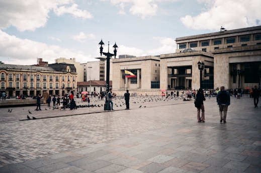 A group of people walking around a courtyard