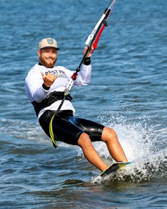 A man riding a surfboard on top of a body of water