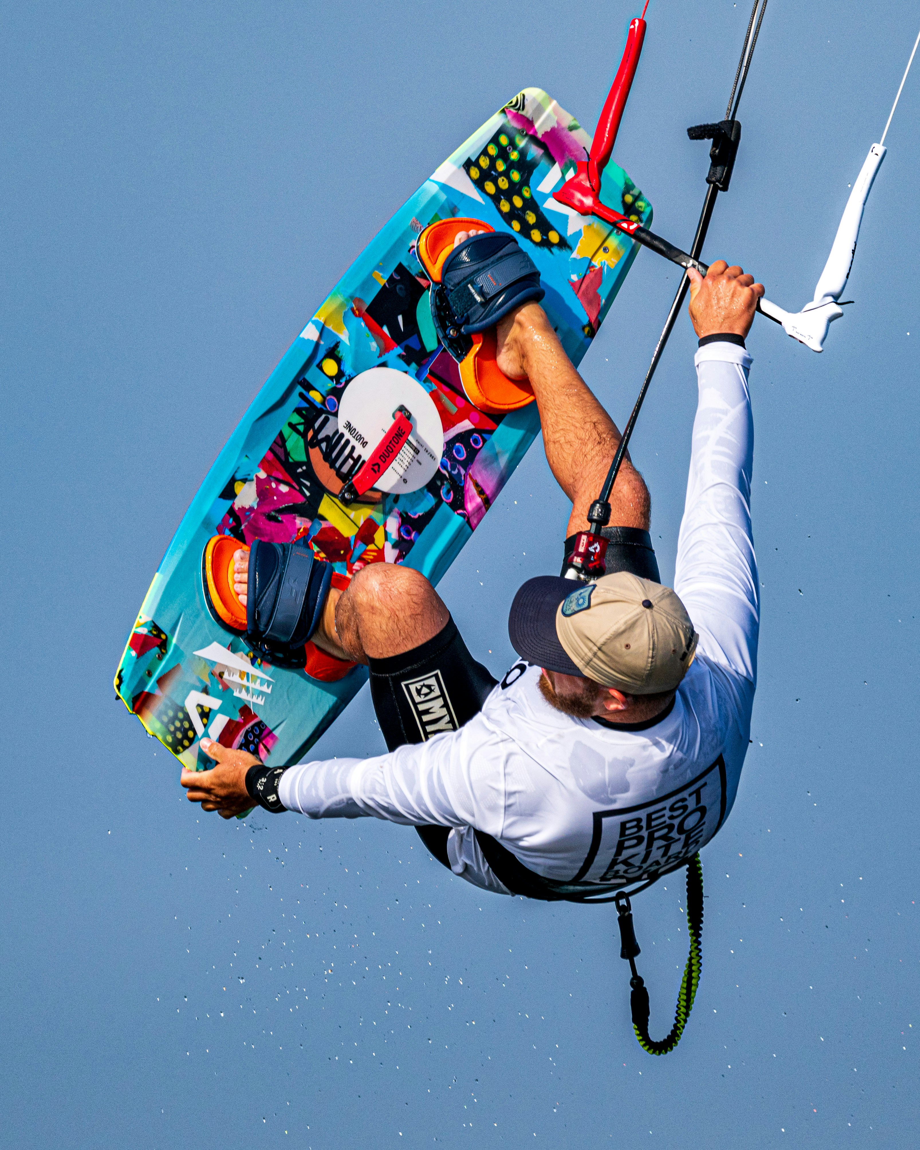 A man is in the air with a kite