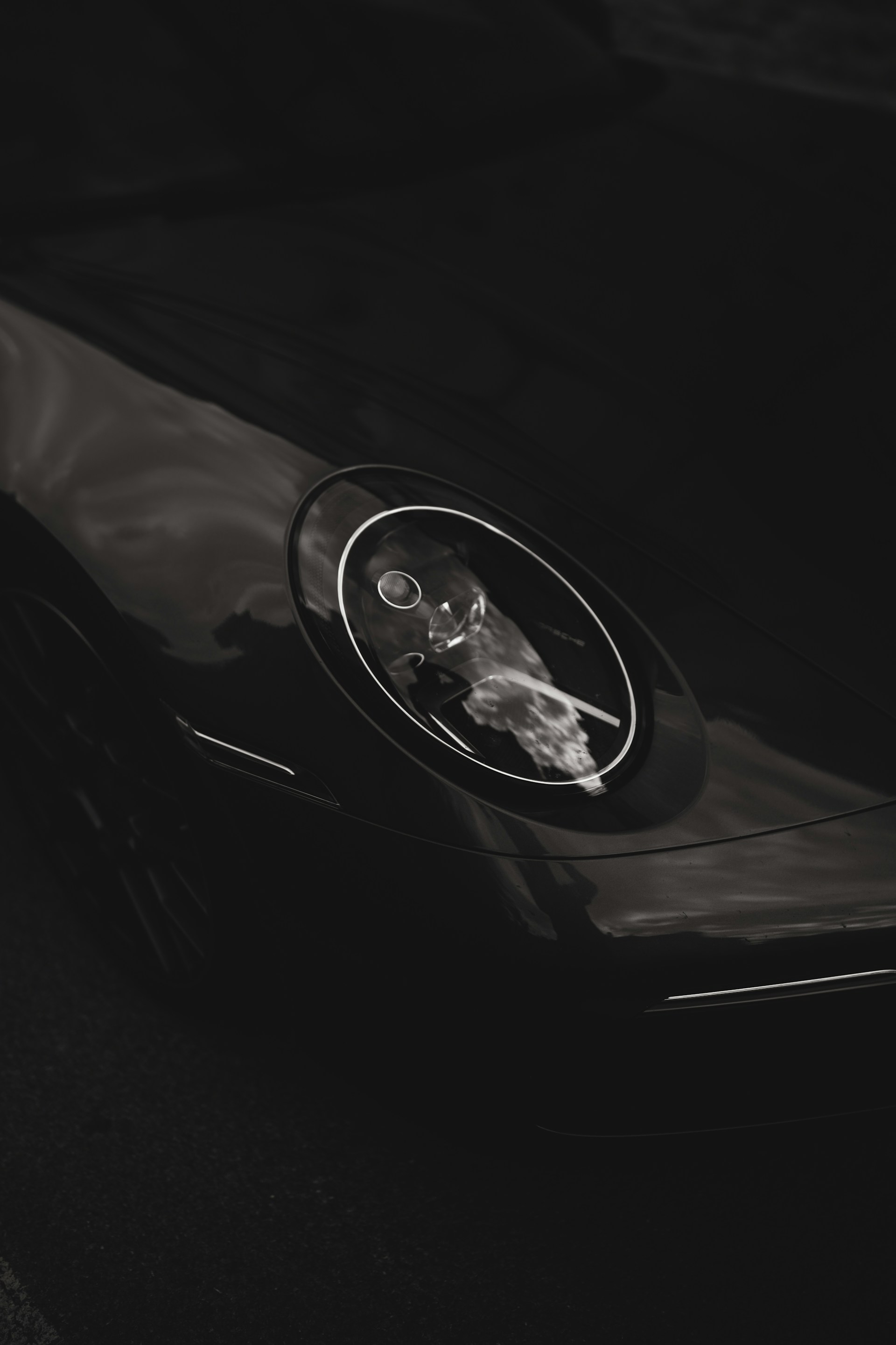 A black and white photo of a car dashboard