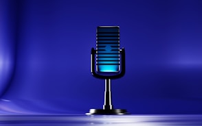 A microphone on a stand on a blue background
