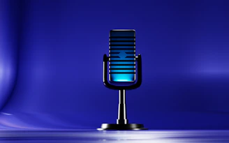 A microphone on a stand on a blue background