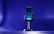 A microphone on a stand on a blue background