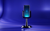 A microphone on a stand with a blue background