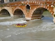 A group of people riding a raft down a river