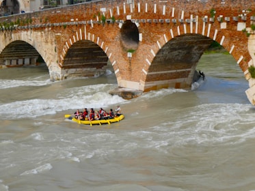 A group of people riding a raft down a river