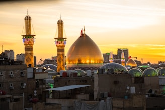 A sunset view of a city with tall buildings