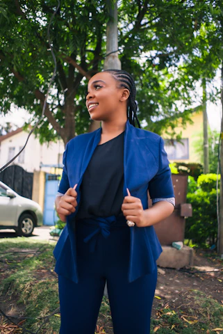 A woman standing in front of a tree