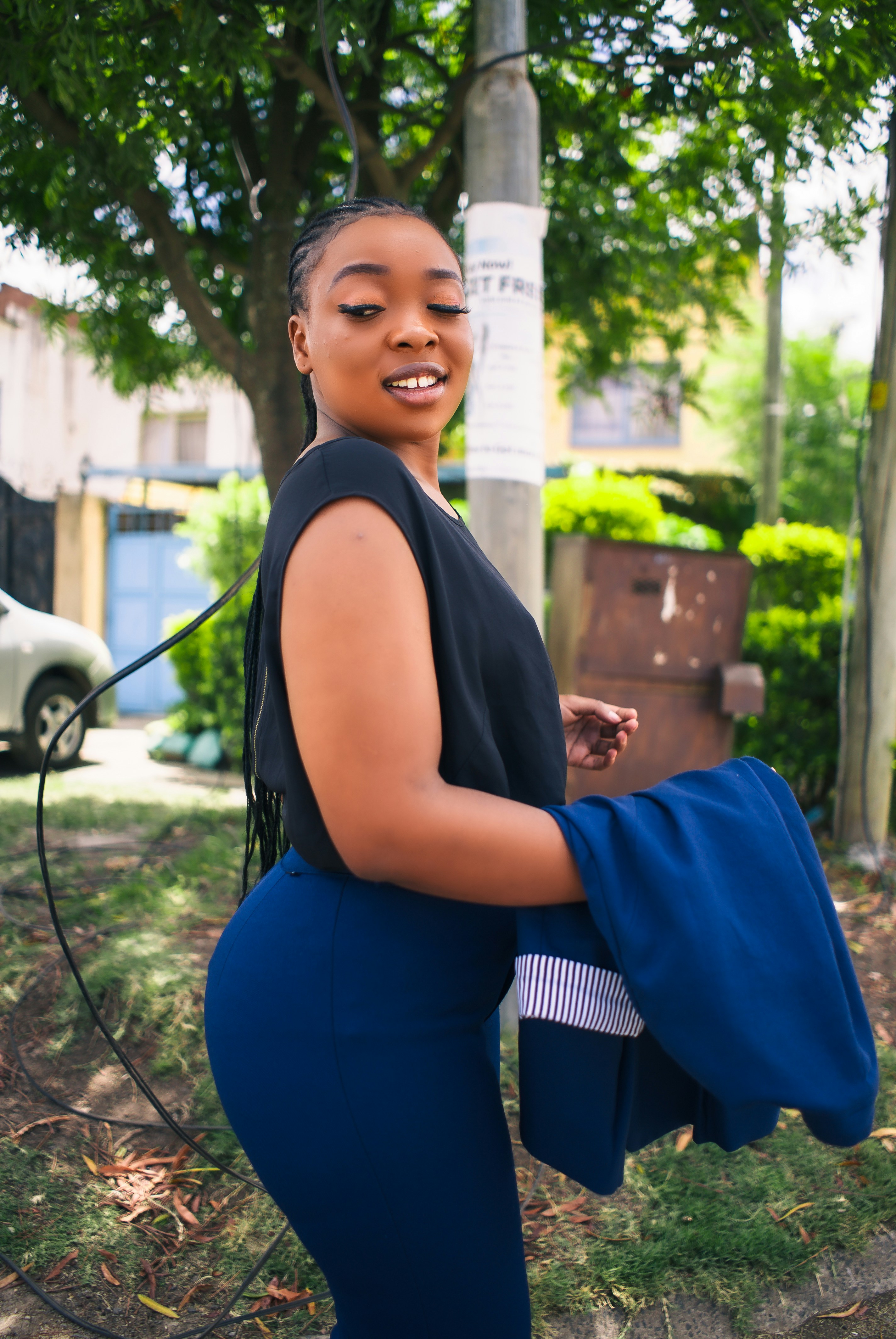 Happy African American woman smiling confidently in bright daylight