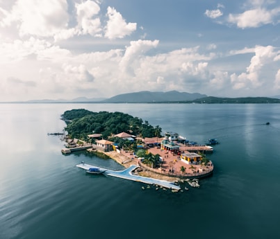 A small island in the middle of a body of water