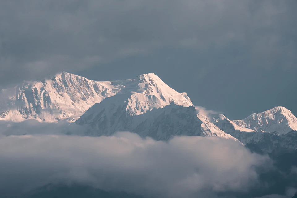 Kanchenjunga's snow summits rising above a sea of cloud, seen from the ridge at Pelling