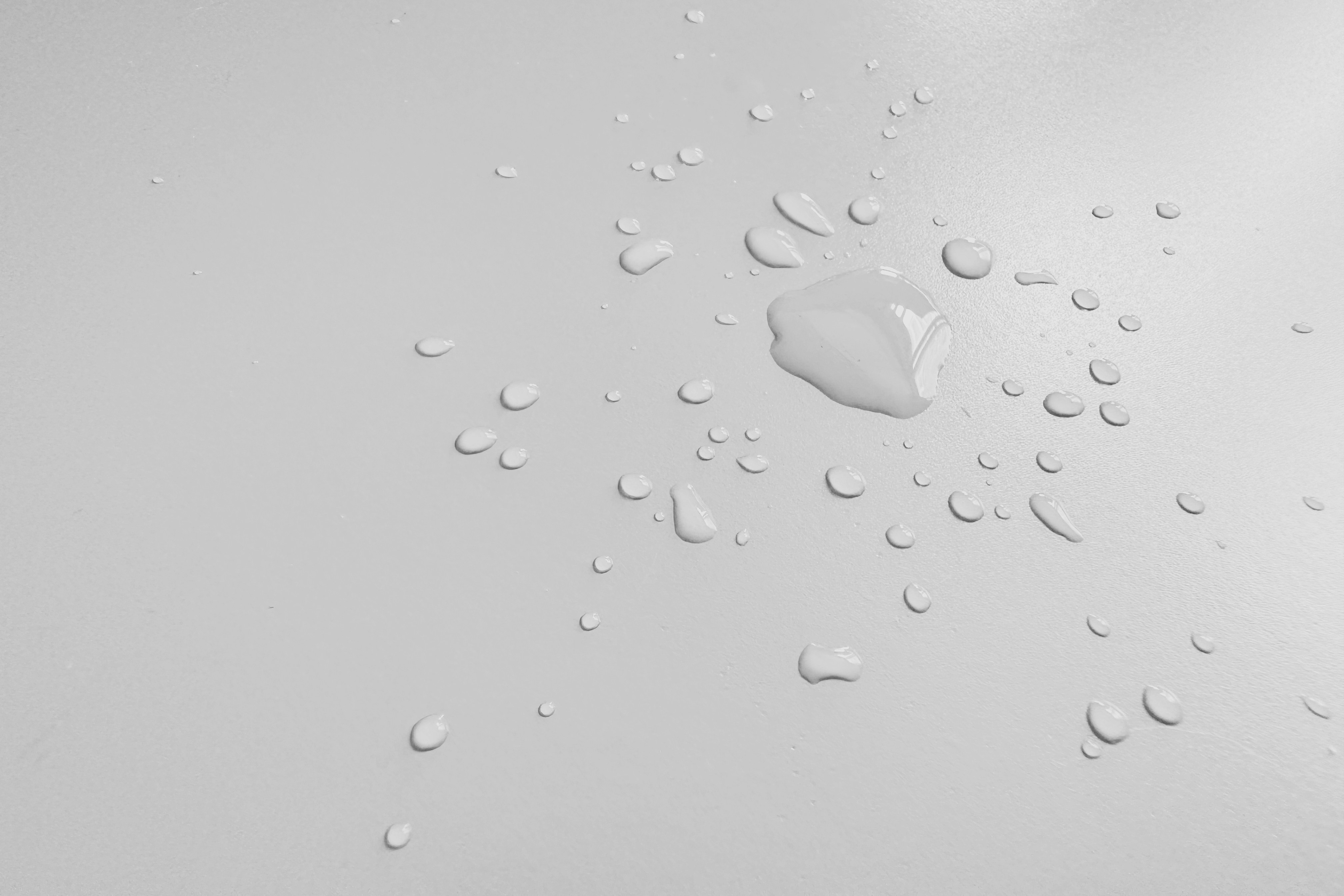 A white background with drops of water on it