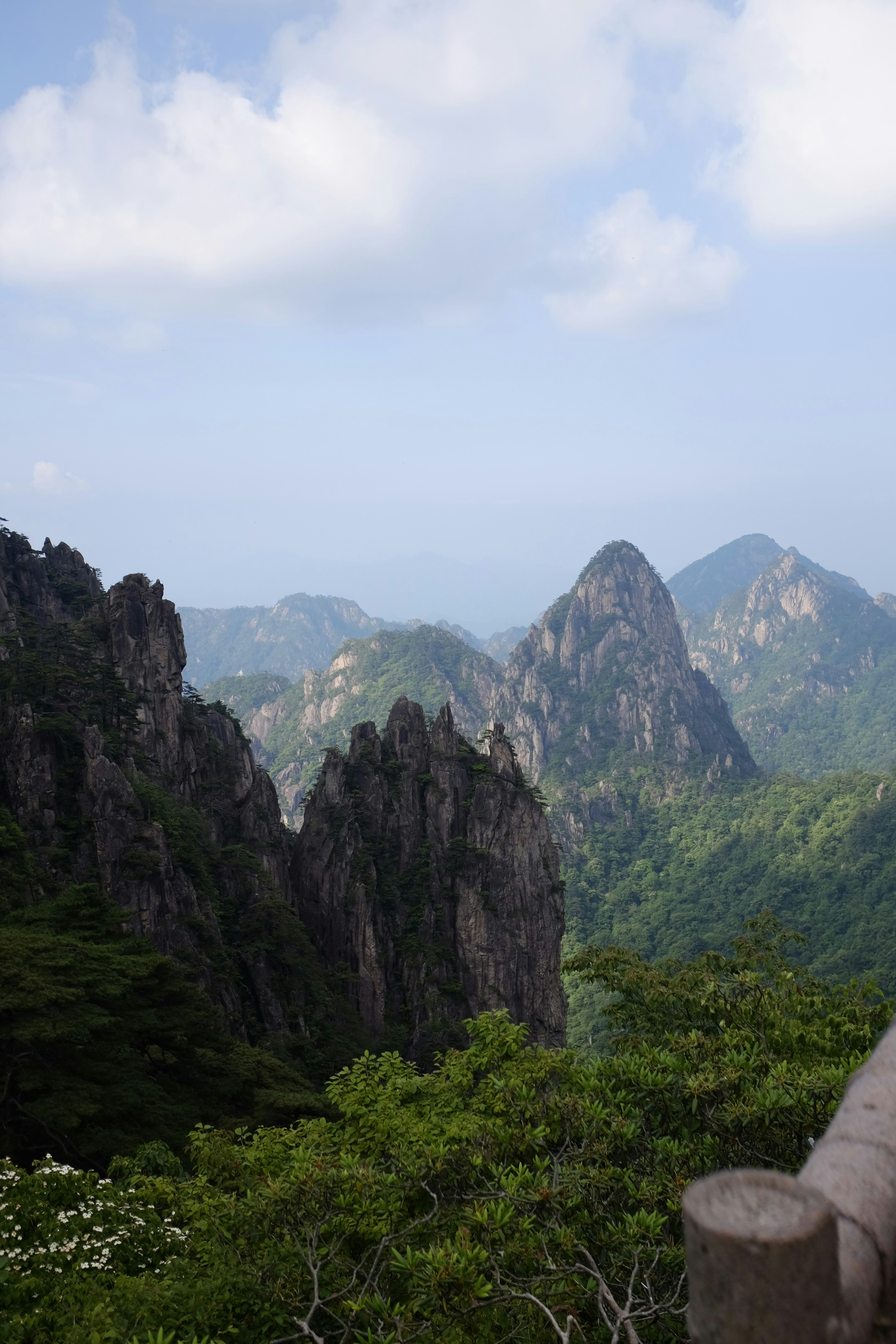 A person taking a picture of a mountain range