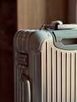 A piece of luggage sitting on top of a hard wood floor