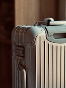 A piece of luggage sitting on top of a hard wood floor