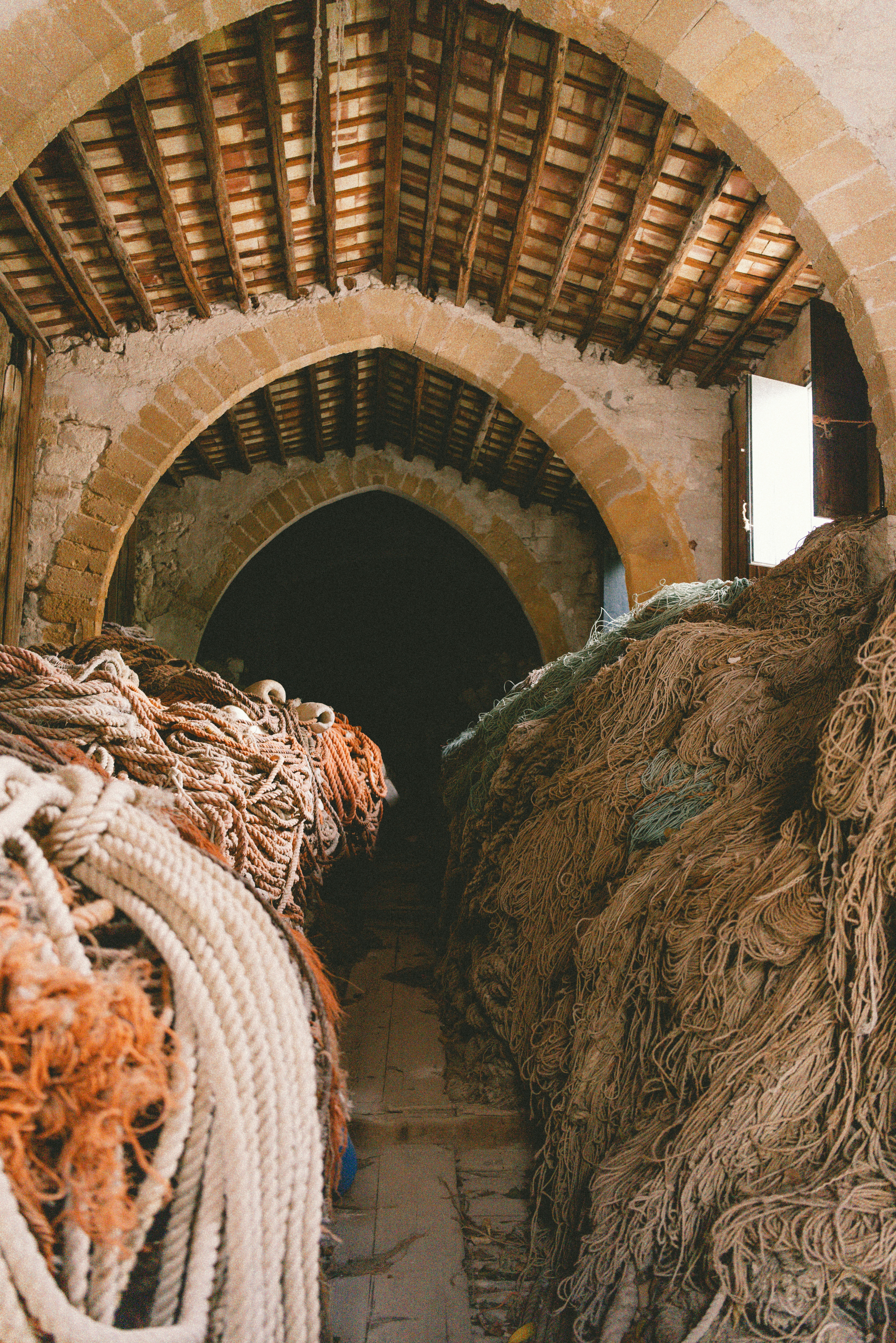 A bunch of rope that are in front of a tunnel