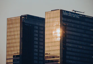 A couple of tall buildings sitting next to each other