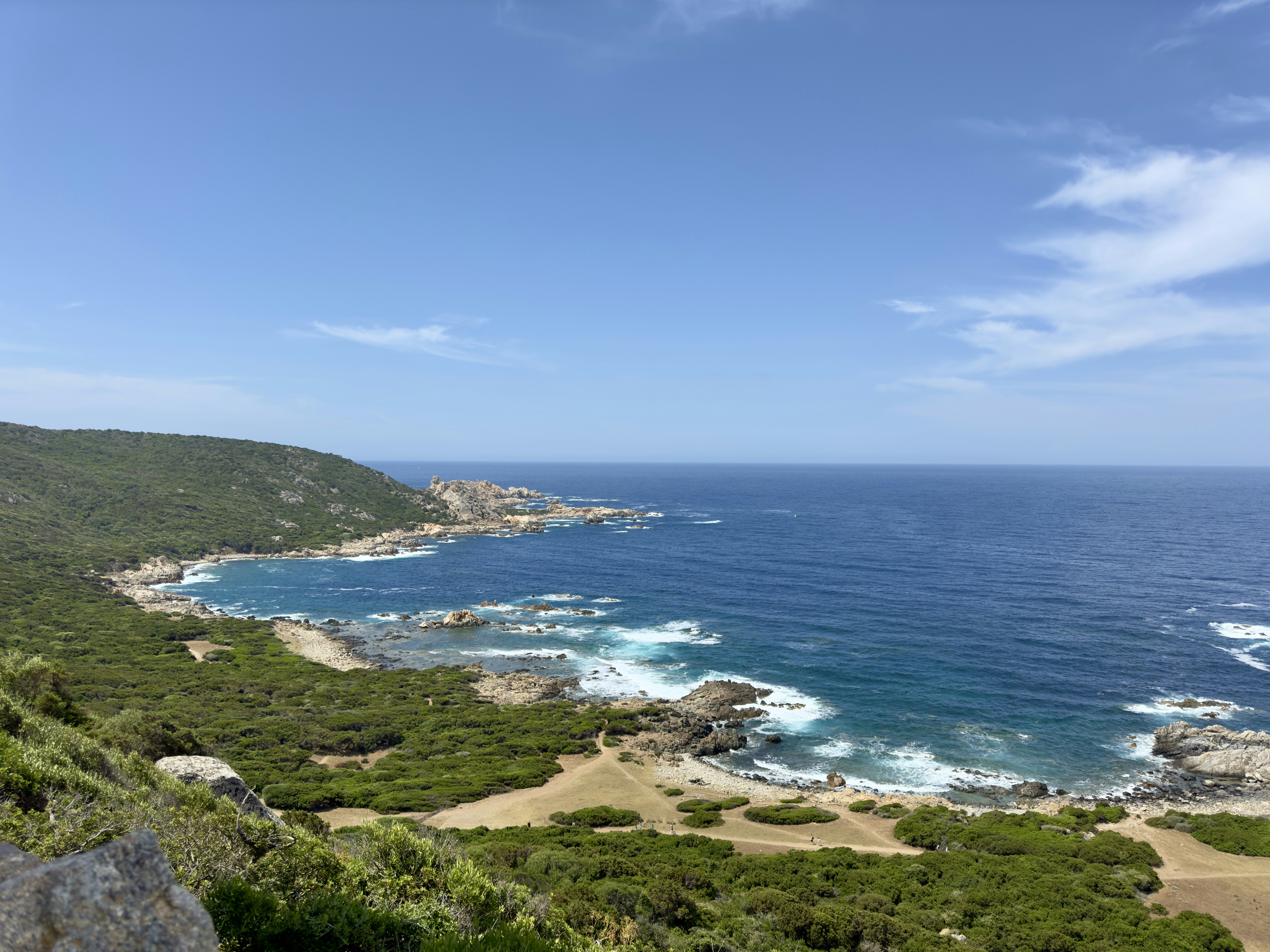 A scenic view of the ocean from a hill