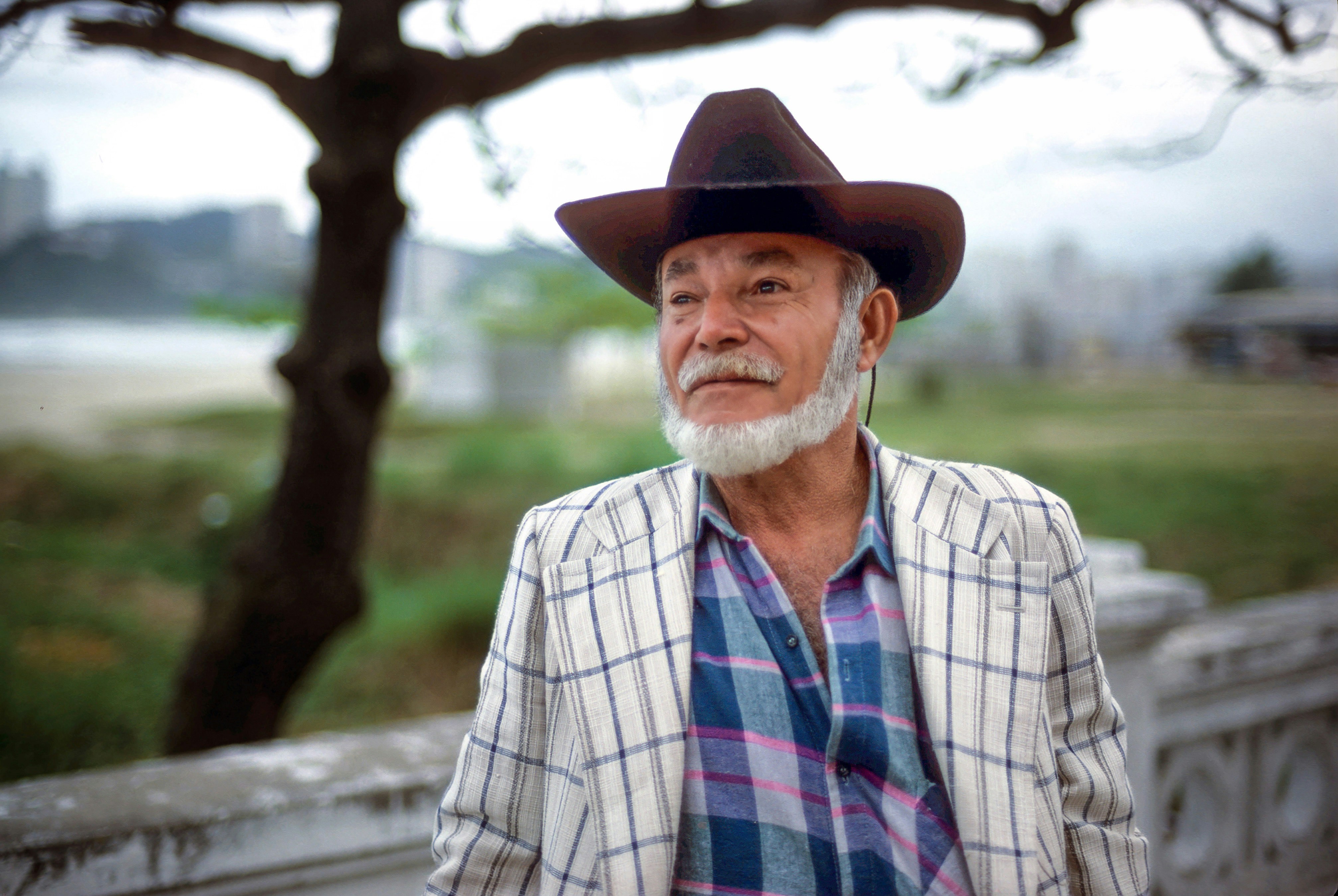 A man with a beard wearing a cowboy hat