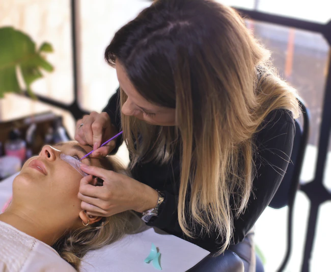 Beauty specialist performing a lash lamination treatment